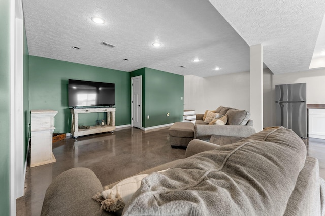 5376 S 140th Rd, Morrisville, MO 65710 - living area with a textured ceiling, baseboards, concrete floors, recessed lighting, and a fireplace