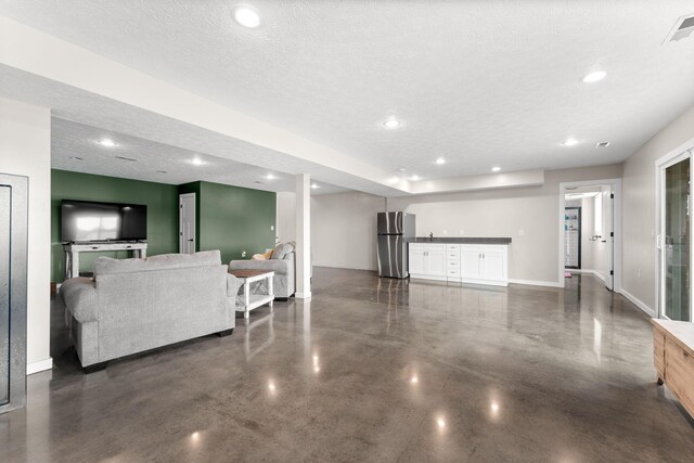 5376 S 140th Rd, Morrisville, MO 65710 - living room with concrete floors, recessed lighting, baseboards, and a textured ceiling