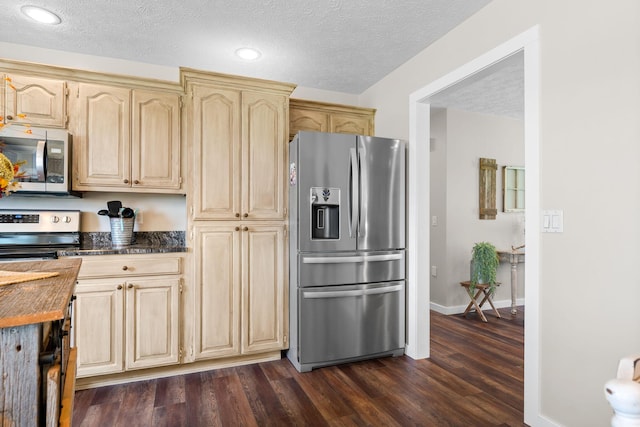 5376 S 140th Rd, Morrisville, MO 65710 - kitchen featuring stainless steel appliances, dark wood-style floors, light brown cabinets, a textured ceiling, and baseboards