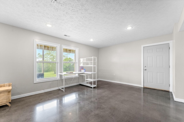 5376 S 140th Rd, Morrisville, MO 65710 - unfurnished room featuring baseboards, finished concrete flooring, a desk, recessed lighting, and a textured ceiling