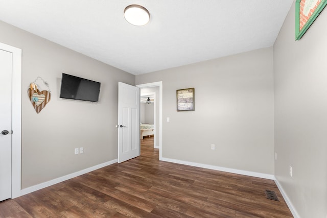 5376 S 140th Rd, Morrisville, MO 65710 - unfurnished bedroom with dark wood-type flooring and baseboards
