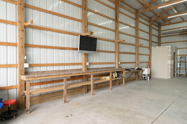 5376 S 140th Rd, Morrisville, MO 65710 - garage with metal wall and a workshop area