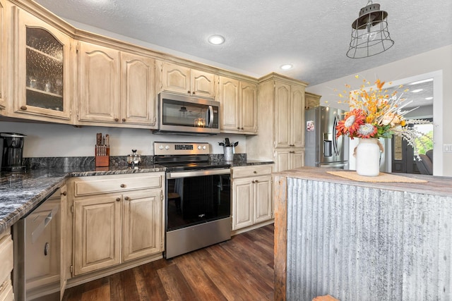 5376 S 140th Rd, Morrisville, MO 65710 - kitchen featuring appliances with stainless steel finishes, dark wood-type flooring, glass insert cabinets, a textured ceiling, and dark stone countertops