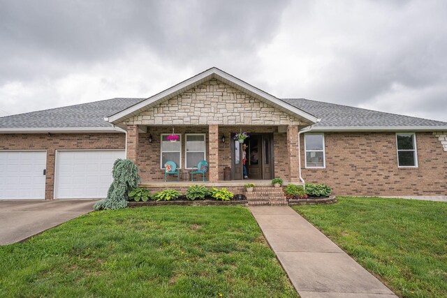 5376 S 140th Rd, Morrisville, MO 65710 - single story home featuring a porch, a front lawn, an attached garage, brick siding, and a shingled roof