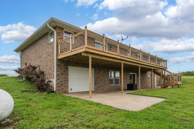 5376 S 140th Rd, Morrisville, MO 65710 - rear view of house with an attached garage, a wooden deck, a yard, and brick siding