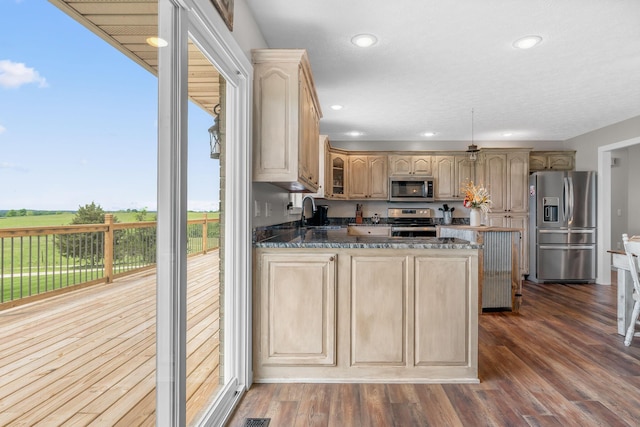 5376 S 140th Rd, Morrisville, MO 65710 - kitchen with appliances with stainless steel finishes, glass insert cabinets, a peninsula, recessed lighting, and light brown cabinetry