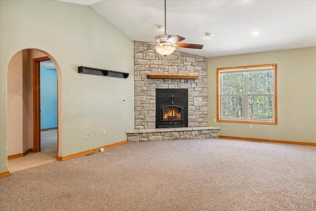 580 Cedar Hill Ln, Marshfield, MO 65706 - unfurnished living room with a ceiling fan, arched walkways, carpet, vaulted ceiling, and baseboards