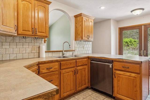 580 Cedar Hill Ln, Marshfield, MO 65706 - kitchen with stainless steel dishwasher, a sink, a peninsula, light countertops, and tasteful backsplash