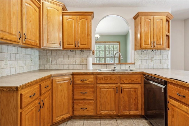 580 Cedar Hill Ln, Marshfield, MO 65706 - kitchen with dishwasher, a sink, light countertops, backsplash, and brown cabinets