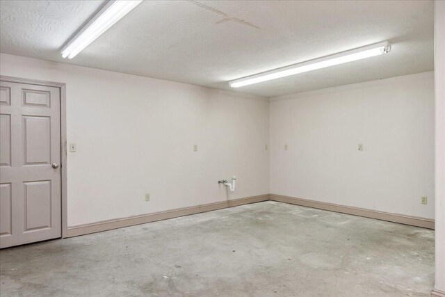 580 Cedar Hill Ln, Marshfield, MO 65706 - spare room featuring unfinished concrete flooring and baseboards