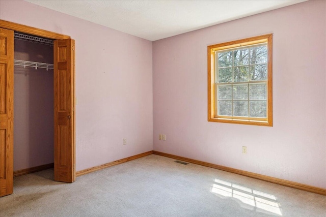 580 Cedar Hill Ln, Marshfield, MO 65706 - unfurnished bedroom featuring light carpet, baseboards, and a closet