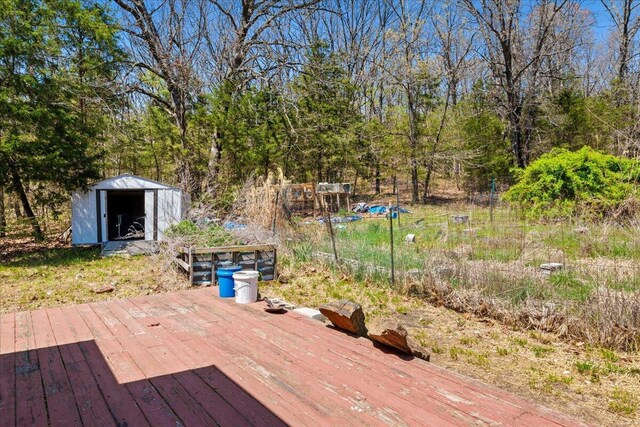 580 Cedar Hill Ln, Marshfield, MO 65706 - wooden deck featuring a storage unit and an outdoor structure