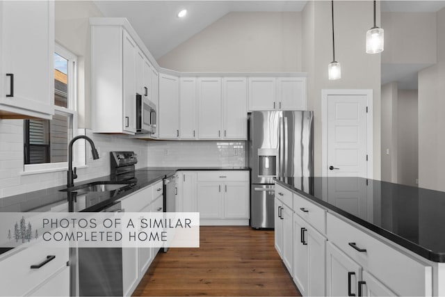 361 Stillwood Dr, Branson, MO 65616 - kitchen featuring appliances with stainless steel finishes, a sink, white cabinets, backsplash, and recessed lighting
