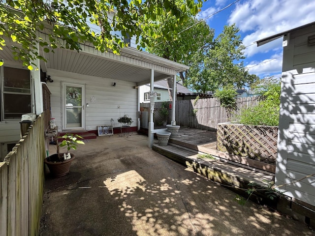 view of patio / terrace with fence and a wooden deck