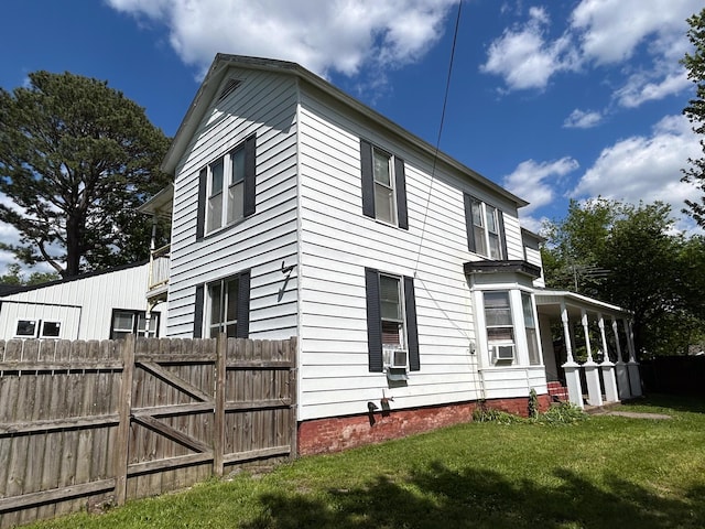 view of side of home featuring cooling unit