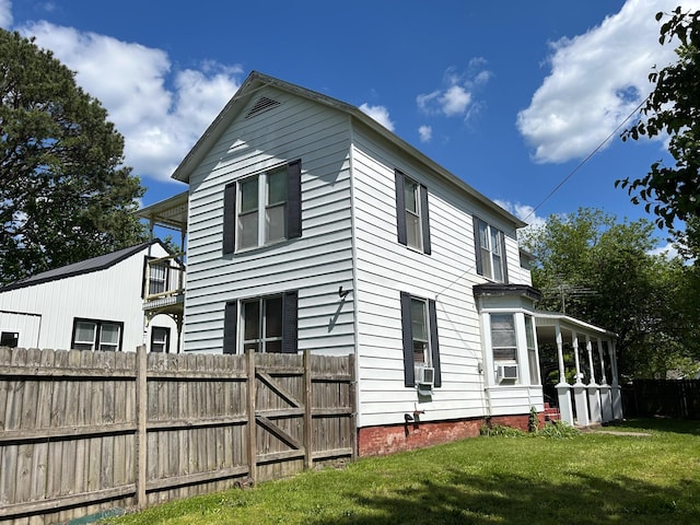 view of side of property featuring cooling unit