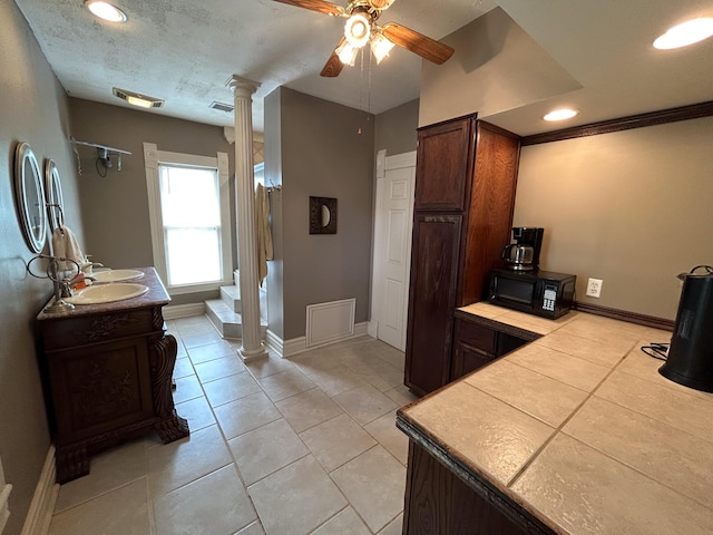 bathroom featuring decorative columns, ceiling fan, tile patterned flooring, recessed lighting, and baseboards