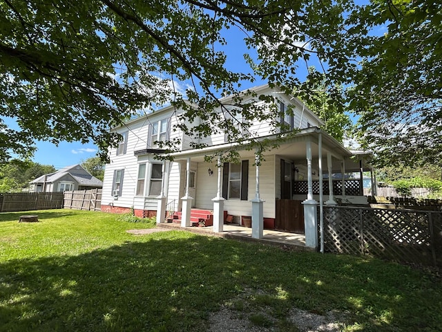rear view of house with a porch