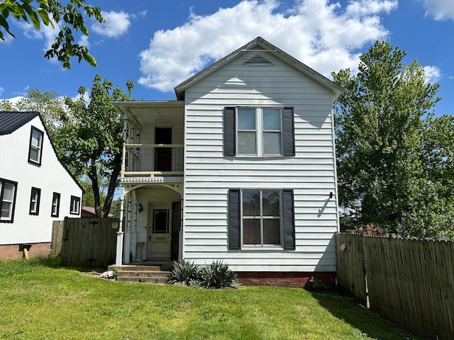 view of front of home with a balcony