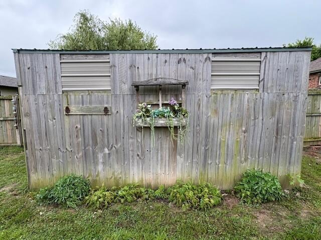 view of outdoor structure with fence