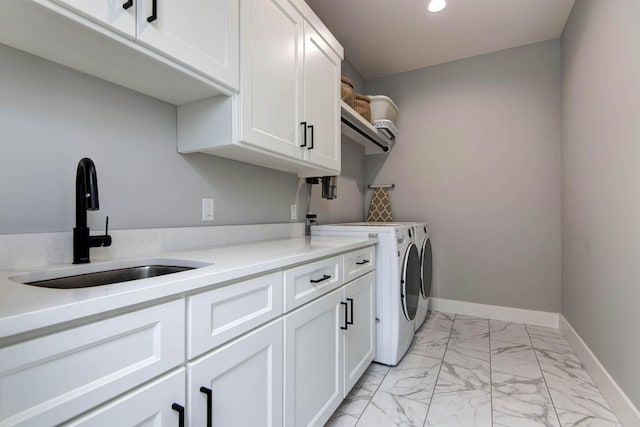 washroom with cabinet space, washing machine and dryer, light marble finish flooring, recessed lighting, and baseboards
