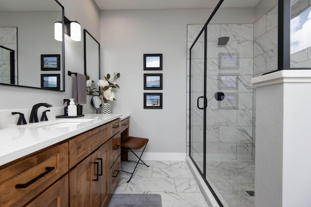 full bath with marble look tiles, a shower stall, vanity, and baseboards