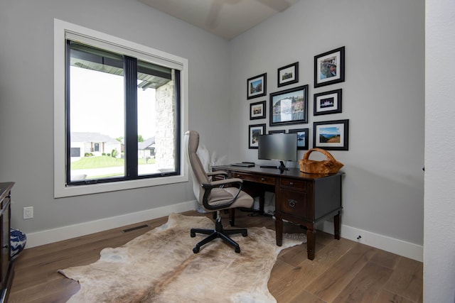 office with baseboards and wood finished floors