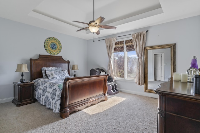 5998 S Parkhaven Ln, Springfield, MO 65810 - bedroom featuring a tray ceiling, carpet, and baseboards