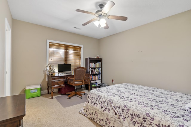 5998 S Parkhaven Ln, Springfield, MO 65810 - carpeted bedroom with a ceiling fan and a desk