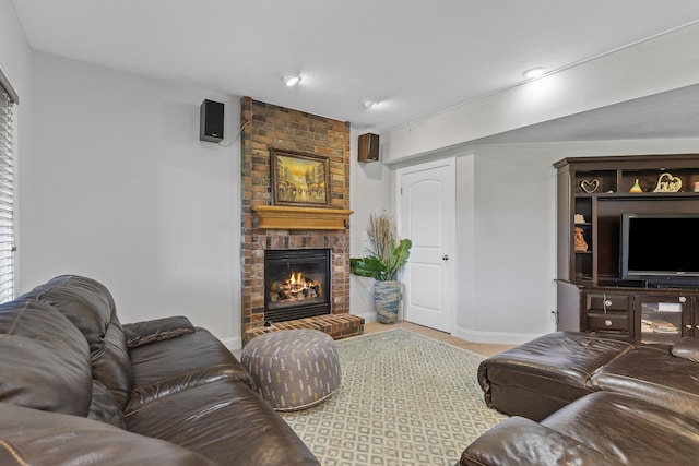 5998 S Parkhaven Ln, Springfield, MO 65810 - carpeted living area with a brick fireplace and baseboards