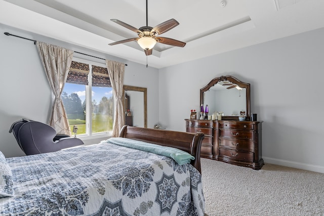 5998 S Parkhaven Ln, Springfield, MO 65810 - carpeted bedroom with baseboards, a ceiling fan, and a tray ceiling