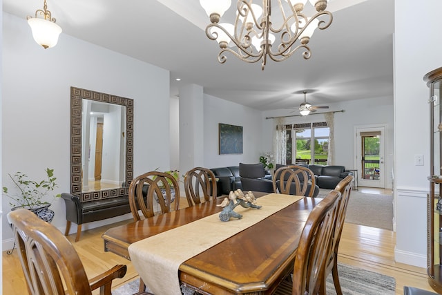 5998 S Parkhaven Ln, Springfield, MO 65810 - dining area with light wood-style flooring, a chandelier, and ceiling fan