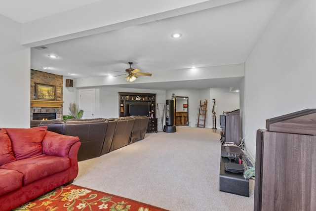 5998 S Parkhaven Ln, Springfield, MO 65810 - carpeted living room with a stone fireplace, ceiling fan, and recessed lighting