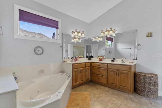5998 S Parkhaven Ln, Springfield, MO 65810 - full bath with vaulted ceiling, a jetted tub, double vanity, and tile patterned flooring