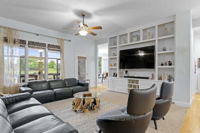5998 S Parkhaven Ln, Springfield, MO 65810 - living area featuring ceiling fan, light wood-style flooring, and baseboards