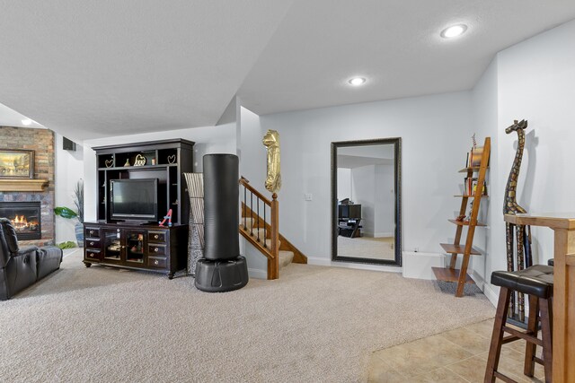 5998 S Parkhaven Ln, Springfield, MO 65810 - carpeted living area with a fireplace, stairs, recessed lighting, and baseboards