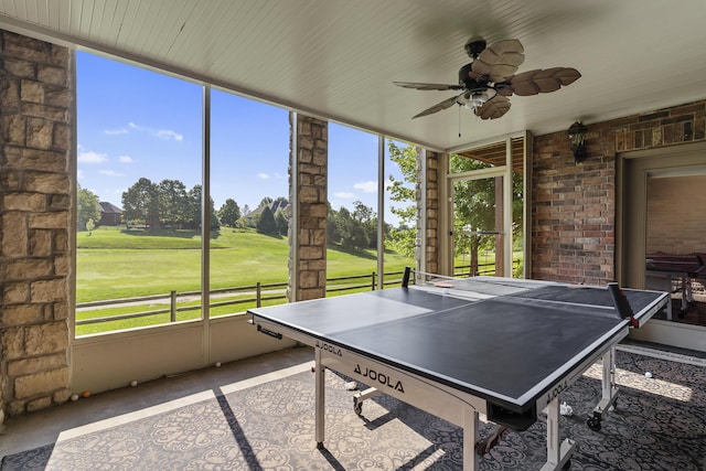 5998 S Parkhaven Ln, Springfield, MO 65810 - game room featuring ceiling fan, view of golf course, and floor to ceiling windows