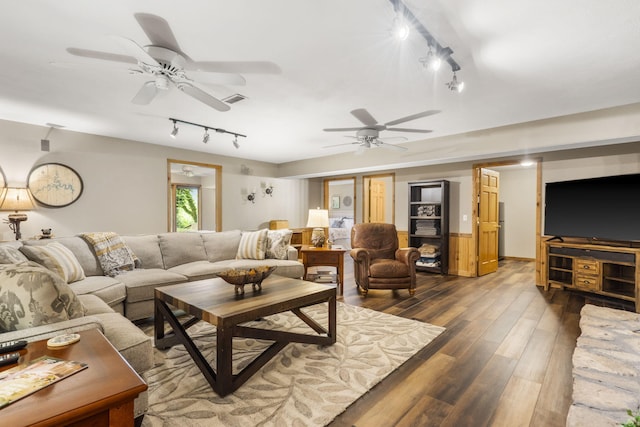1294 Acacia Club Rd, Hollister, MO 65672 - living room with rail lighting, a ceiling fan, and dark wood-style flooring