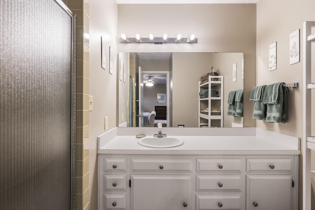 1294 Acacia Club Rd, Hollister, MO 65672 - bathroom featuring vanity, ceiling fan, a shower with door, and ensuite bathroom
