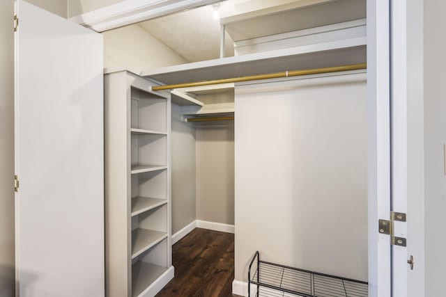 1294 Acacia Club Rd, Hollister, MO 65672 - walk in closet with dark wood-type flooring