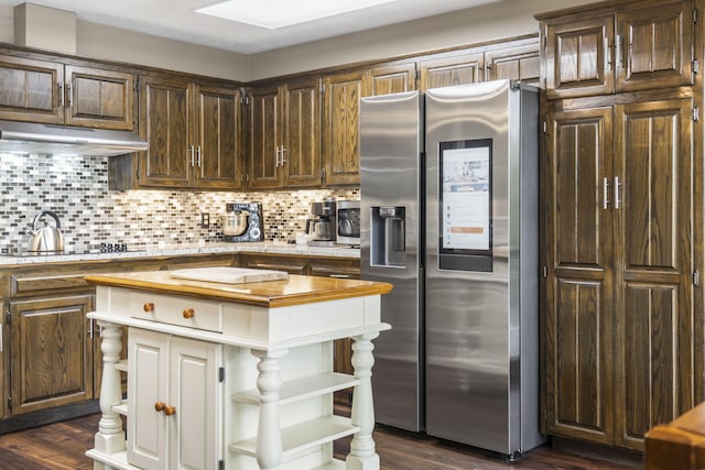 1294 Acacia Club Rd, Hollister, MO 65672 - kitchen featuring stainless steel refrigerator with ice dispenser, open shelves, under cabinet range hood, and tasteful backsplash