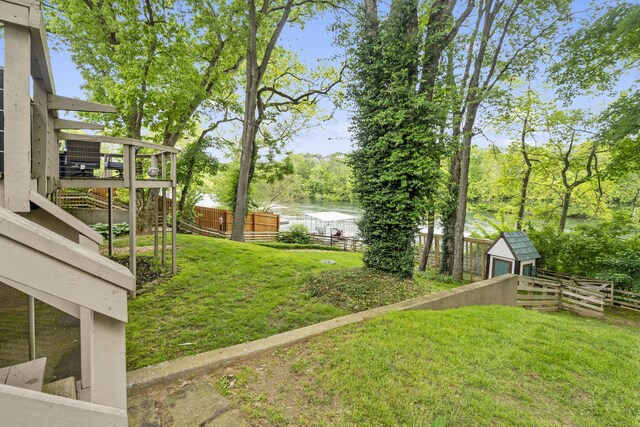 1294 Acacia Club Rd, Hollister, MO 65672 - view of yard featuring a water view, an outbuilding, and a storage shed