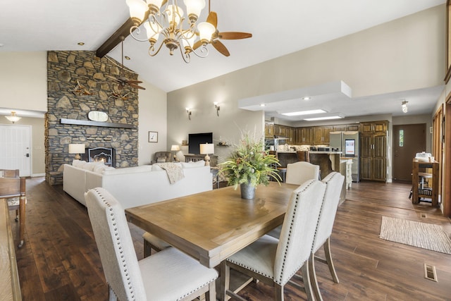 1294 Acacia Club Rd, Hollister, MO 65672 - dining room with dark wood-style floors, a chandelier, a stone fireplace, and ceiling fan