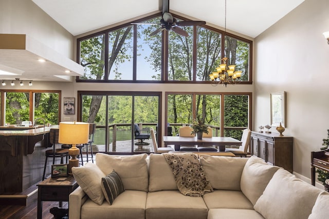 1294 Acacia Club Rd, Hollister, MO 65672 - living area featuring high vaulted ceiling, a chandelier, dark wood-style floors, and ceiling fan