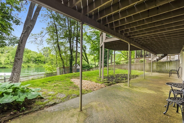 1294 Acacia Club Rd, Hollister, MO 65672 - view of patio with a water view, stairs, and fence
