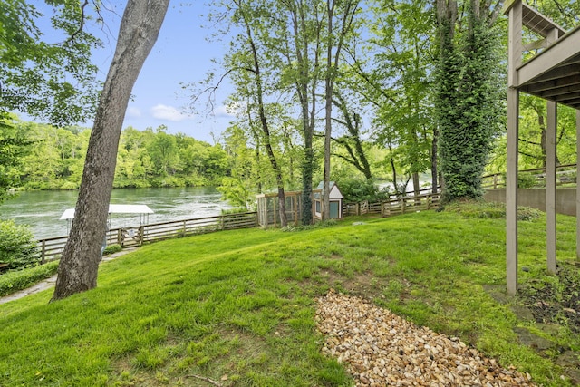 1294 Acacia Club Rd, Hollister, MO 65672 - view of yard featuring a water view, an outbuilding, and a storage unit
