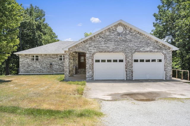 170 Sundance Rd, Cape Fair, MO 65624 - ranch-style home featuring a garage, concrete driveway, brick siding, and a front lawn