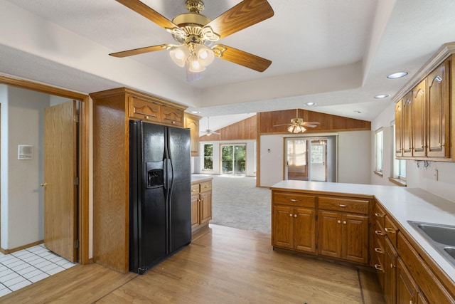 170 Sundance Rd, Cape Fair, MO 65624 - kitchen with black refrigerator with ice dispenser, vaulted ceiling, a ceiling fan, a peninsula, and brown cabinets