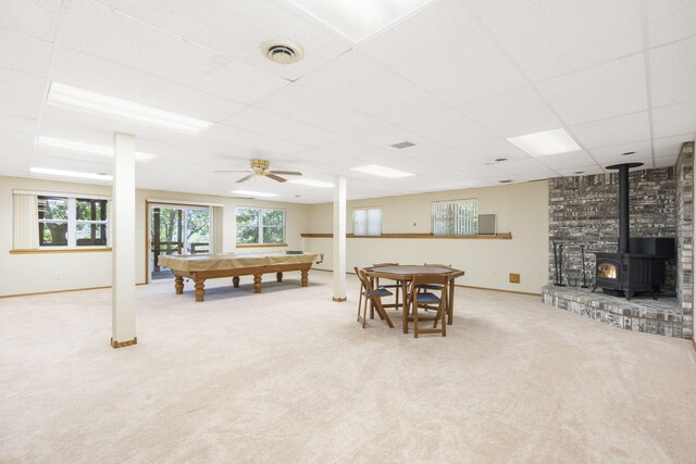 170 Sundance Rd, Cape Fair, MO 65624 - recreation room with carpet flooring, a wood stove, a drop ceiling, billiards table, and healthy amount of natural light
