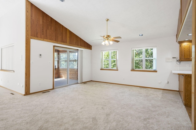 170 Sundance Rd, Cape Fair, MO 65624 - unfurnished living room featuring ceiling fan, baseboards, light carpet, and vaulted ceiling